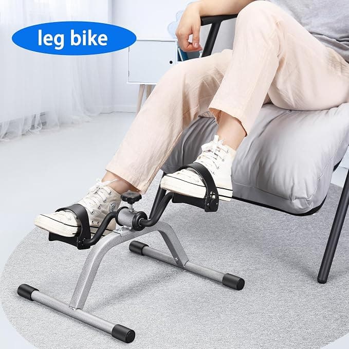 Leg bike pedal exerciser used while relaxing in an armchair